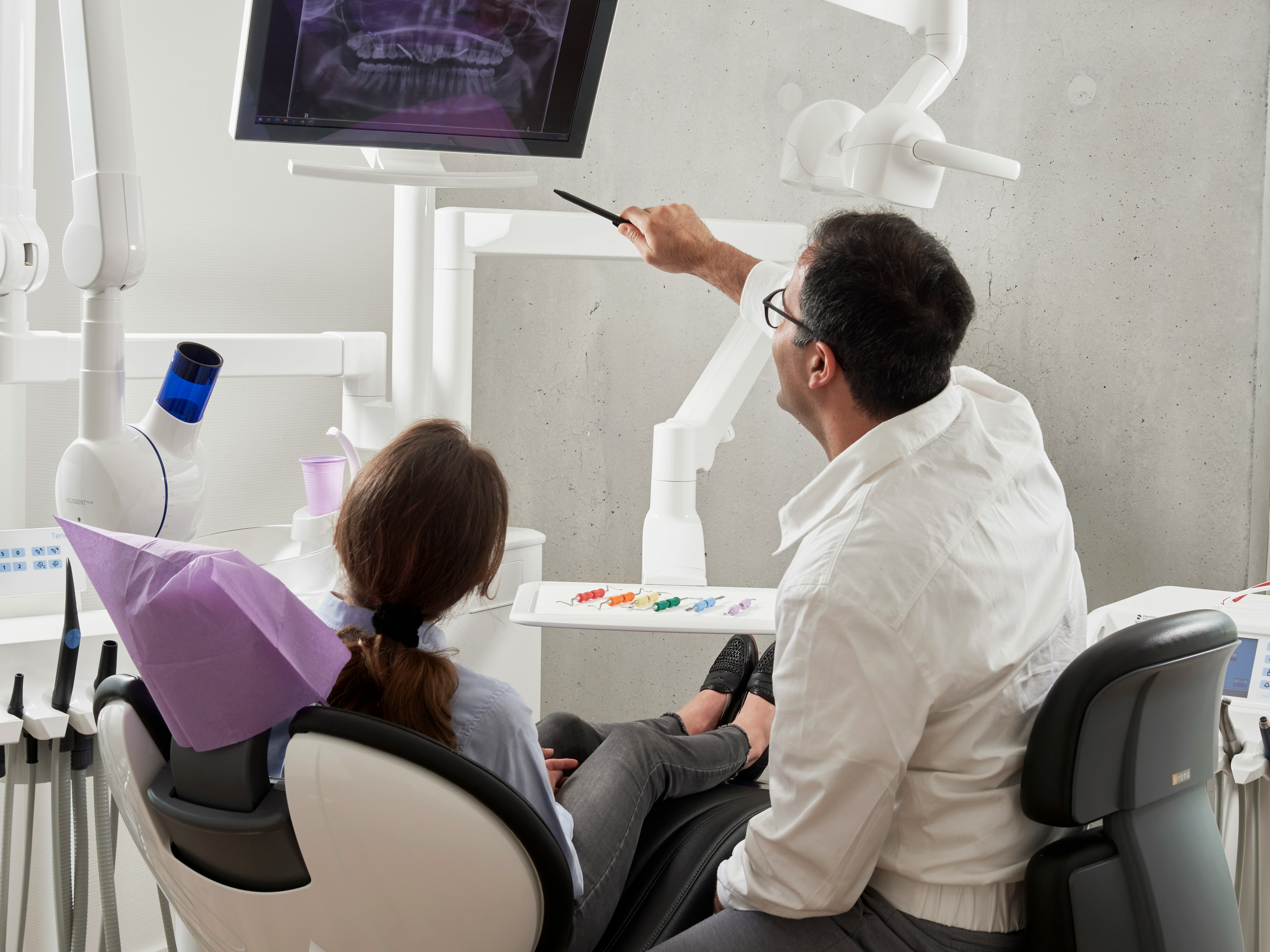 Dentist showing patient an x-ray